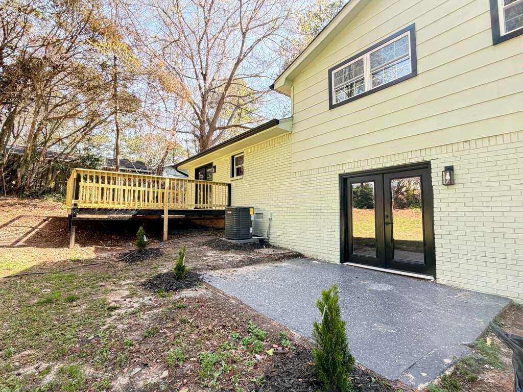 7367 Rountree Drive Riverdale, GA 30274 - Photo 4 of 18 a view of a house with a yard and wooden fence