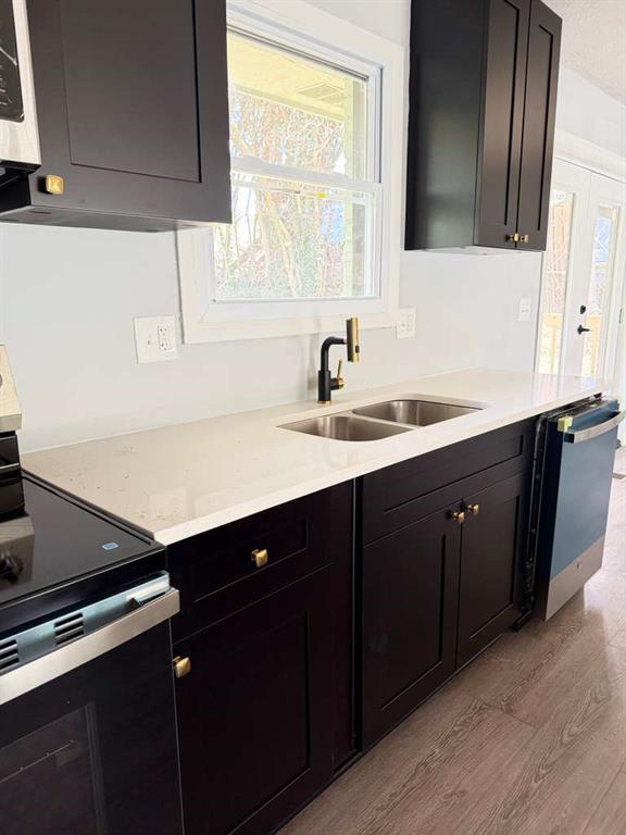 7367 Rountree Drive Riverdale, GA 30274 - Photo 7 of 18 a kitchen with a sink cabinets and a window