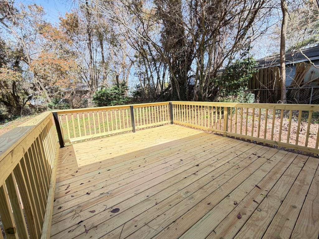 7367 Rountree Drive Riverdale, GA 30274 - Photo 9 of 18 a view of deck with wooden floor and fence