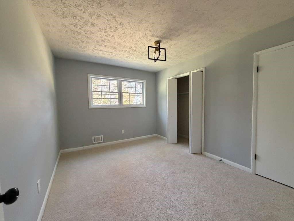 7367 Rountree Drive Riverdale, GA 30274 - Photo 10 of 18 an empty room with windows