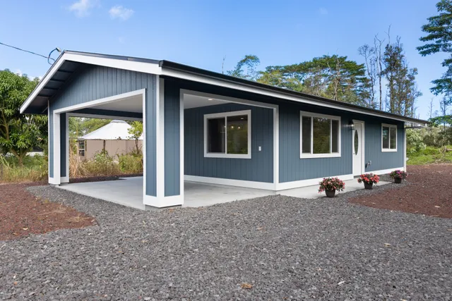a front view of house with mountain view and garden