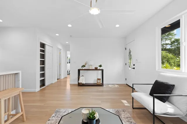 a living room with furniture and a window