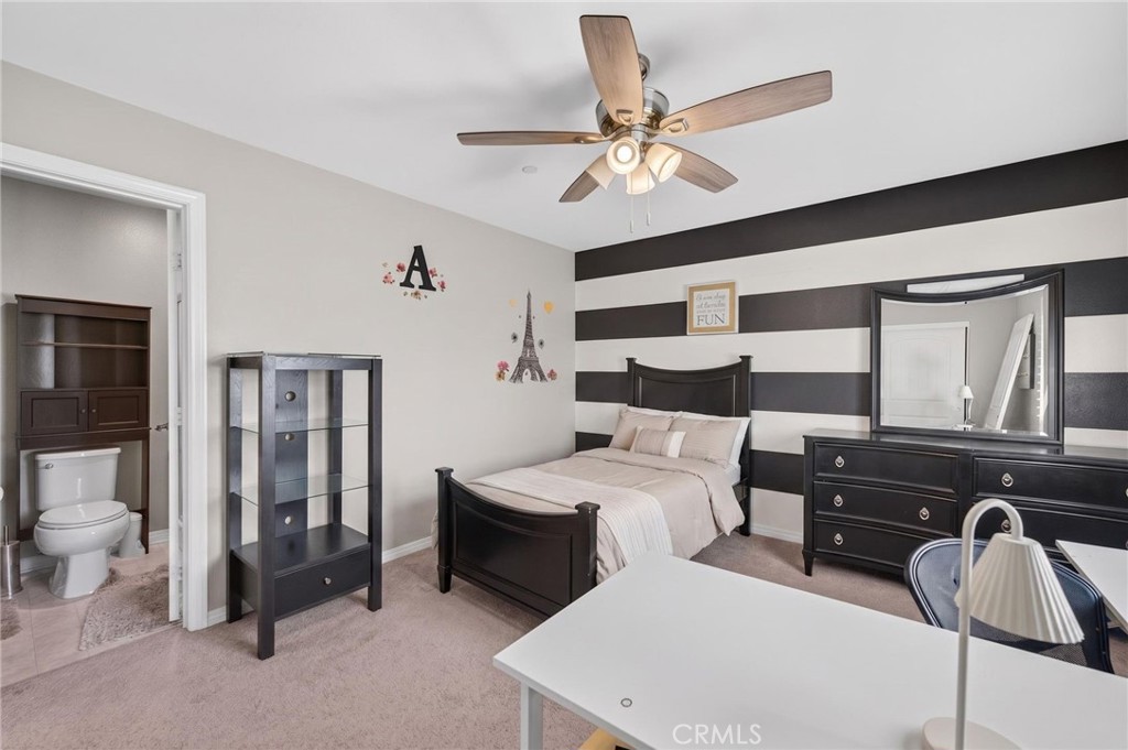 23347 Crystal Way Wildomar, CA 92595 - Photo 72 of 109 a bedroom with a bed and a chandelier