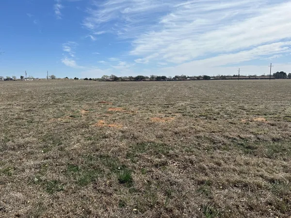 a view of a large body of water in between two buildings