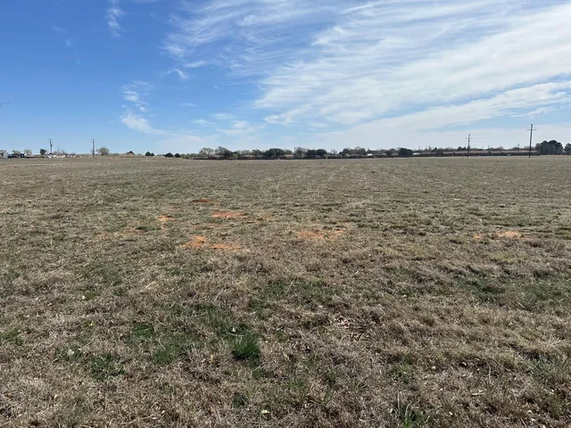 a view of a large body of water in between two buildings
