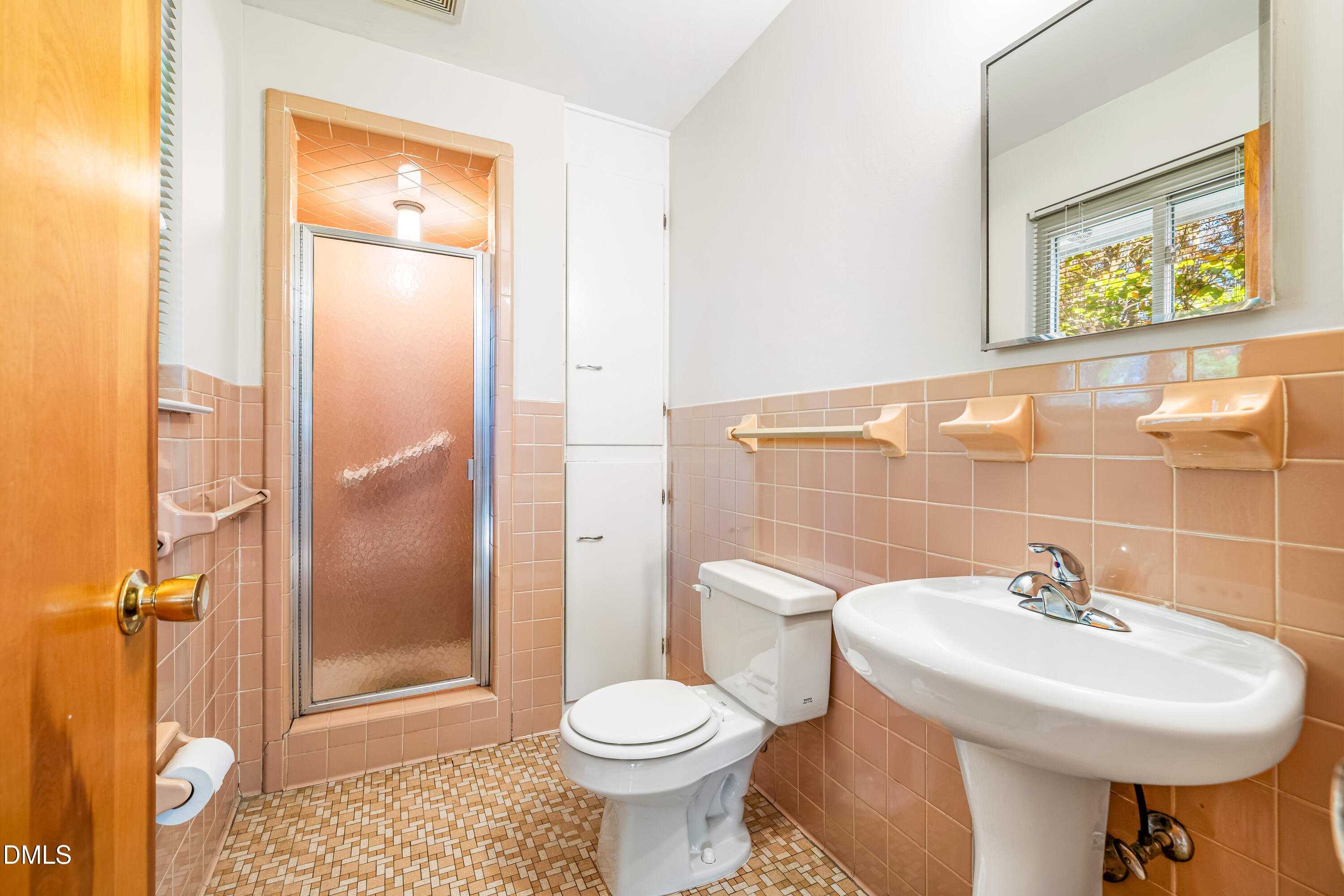 4714 West Hills Drive Durham, NC 27705 - Photo 12 of 27 a bathroom with a sink toilet and shower