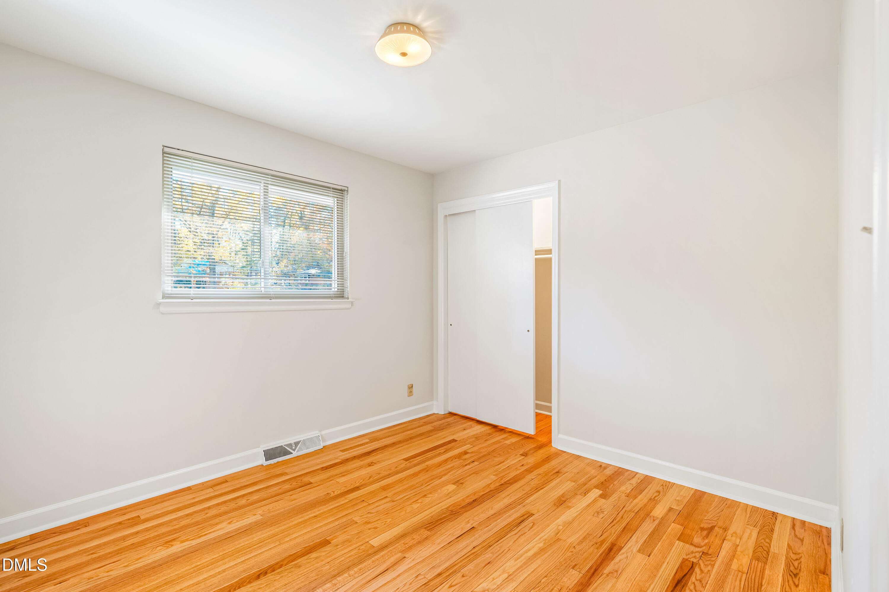 4714 West Hills Drive Durham, NC 27705 - Photo 13 of 27 a view of empty room with wooden floor