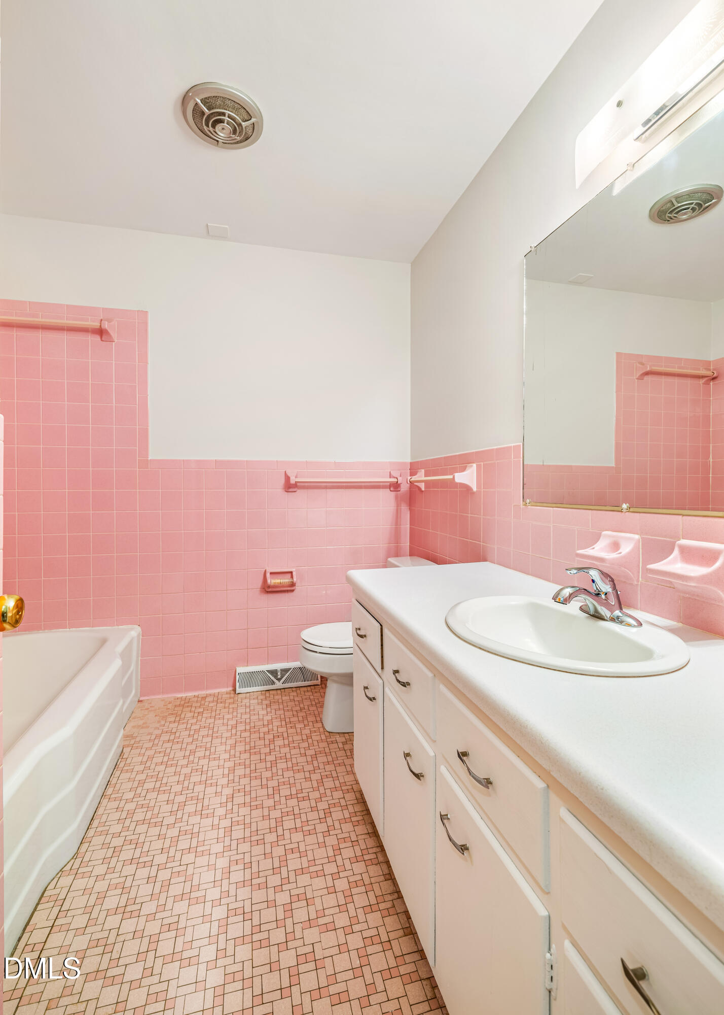 4714 West Hills Drive Durham, NC 27705 - Photo 14 of 27 a bathroom with a sink a toilet and a mirror