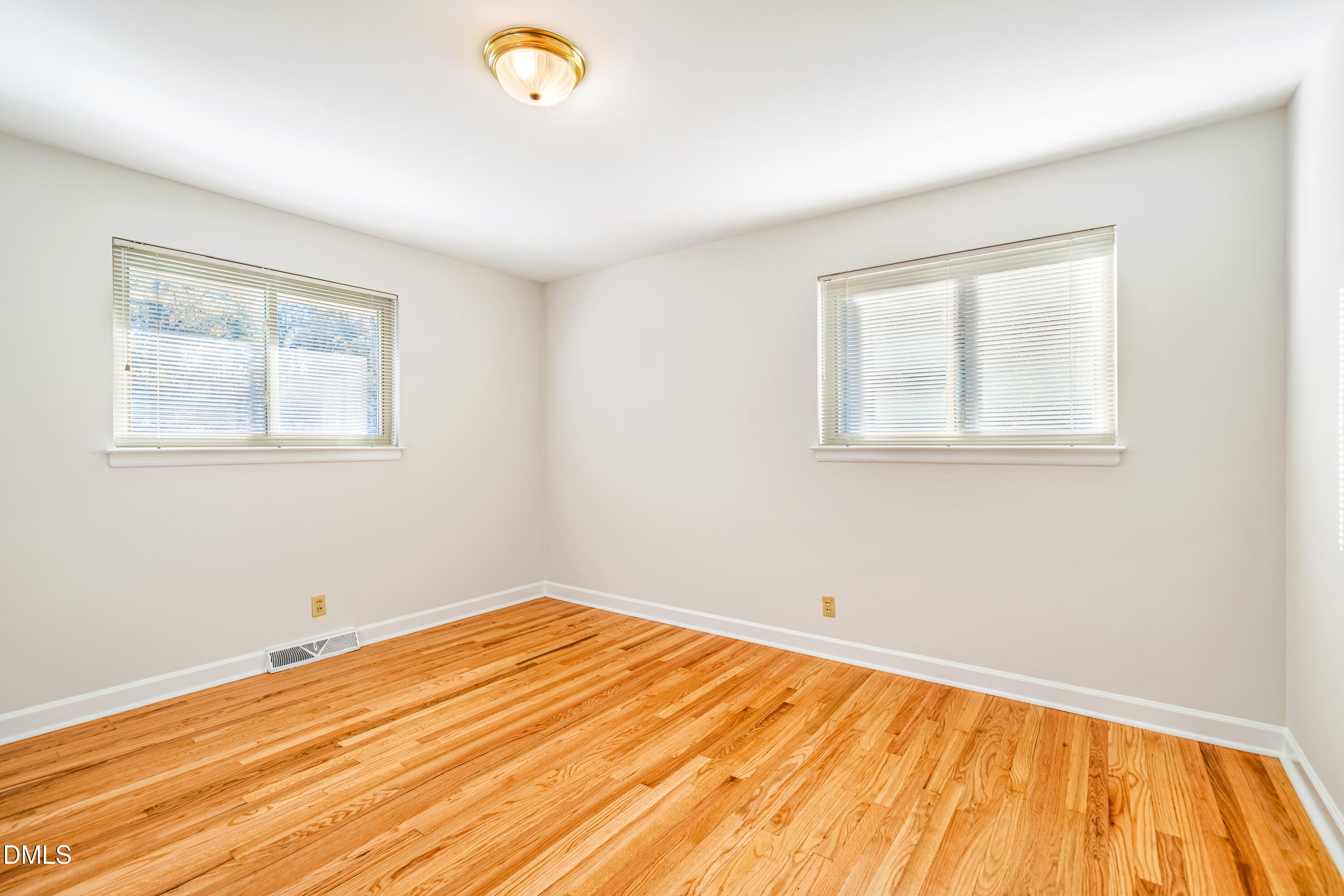 4714 West Hills Drive Durham, NC 27705 - Photo 15 of 27 a view of empty room with wooden floor