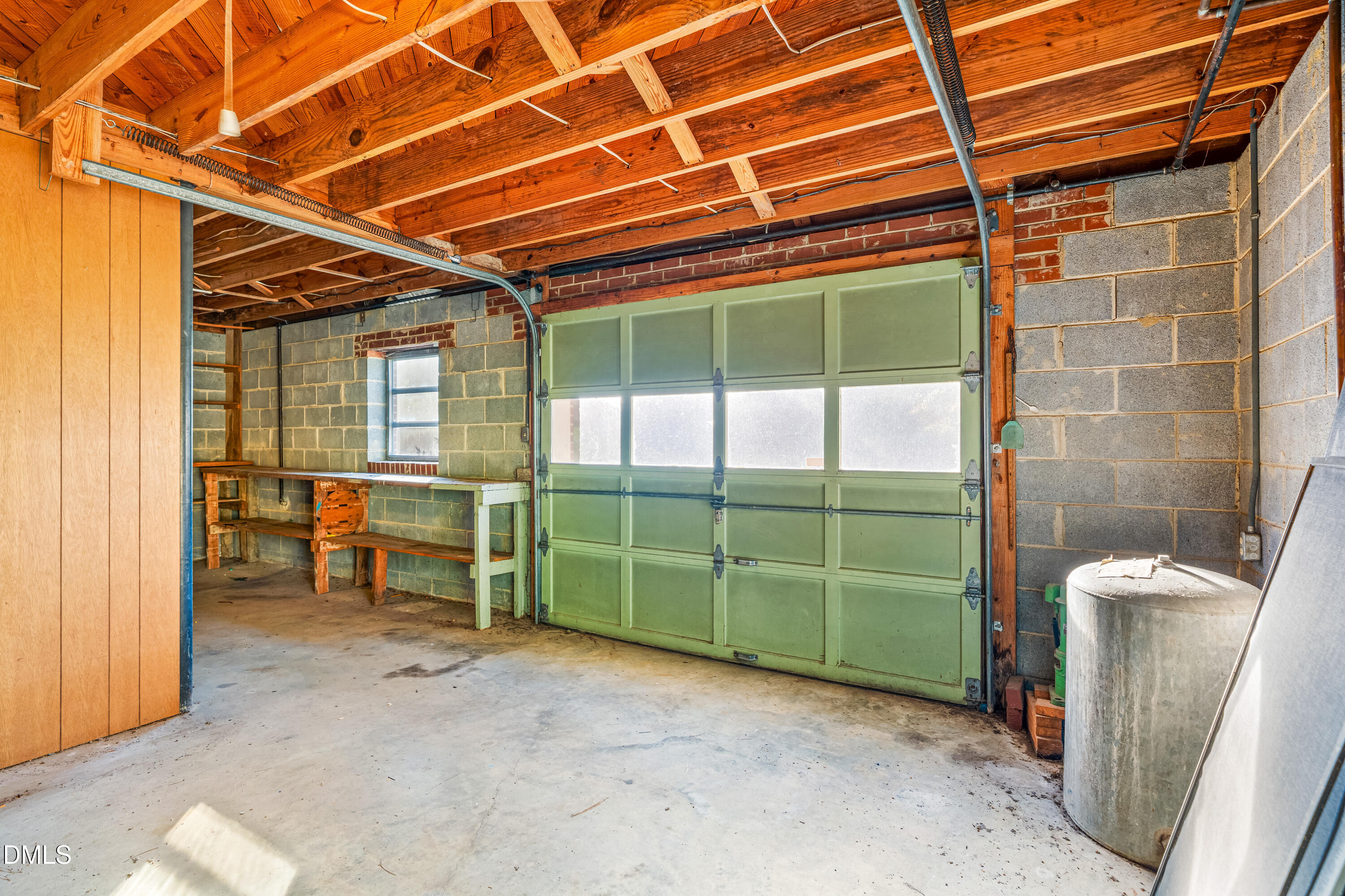 4714 West Hills Drive Durham, NC 27705 - Photo 17 of 27 a view of a room with washing machine and racks