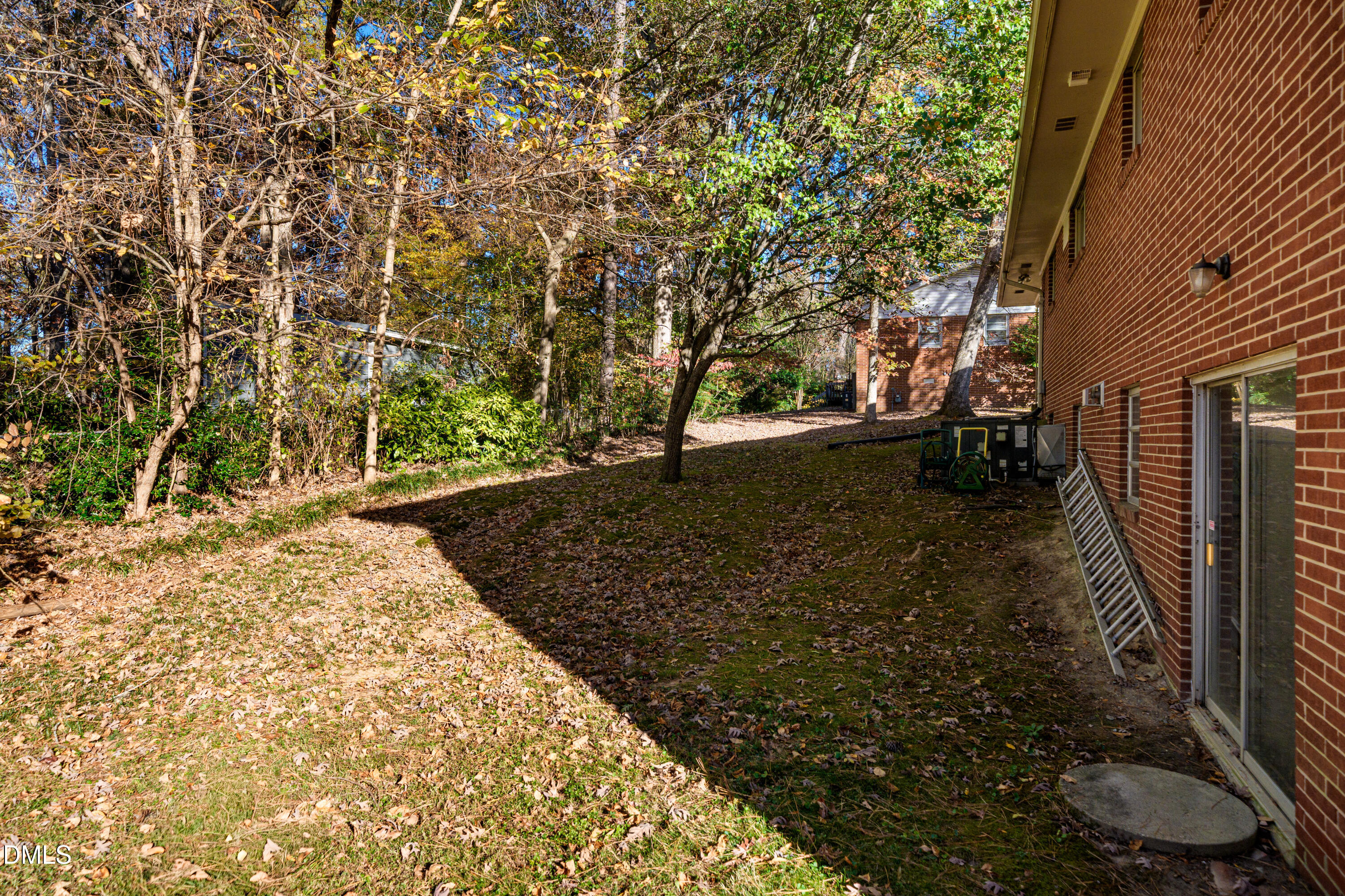 4714 West Hills Drive Durham, NC 27705 - Photo 24 of 27 a view of a yard with plants and trees
