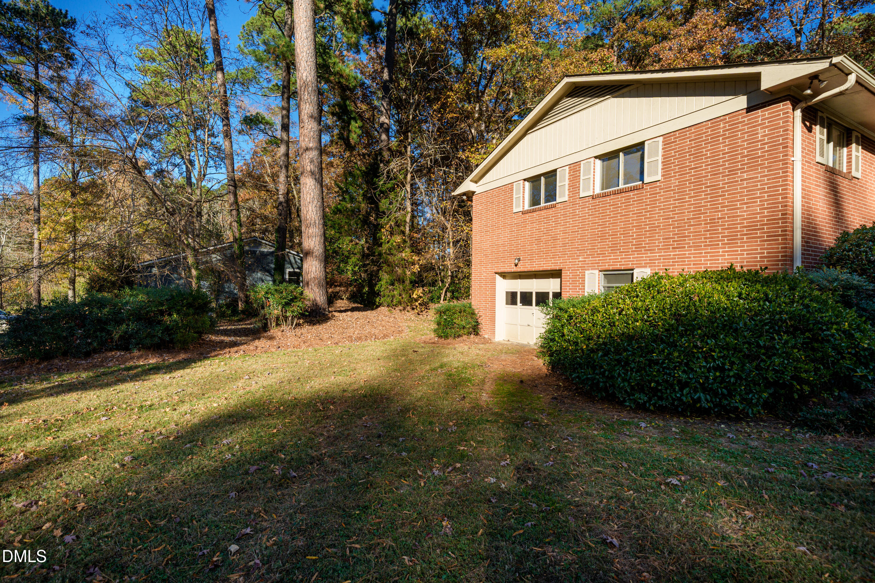 4714 West Hills Drive Durham, NC 27705 - Photo 26 of 27 a front view of a house with a yard and garage
