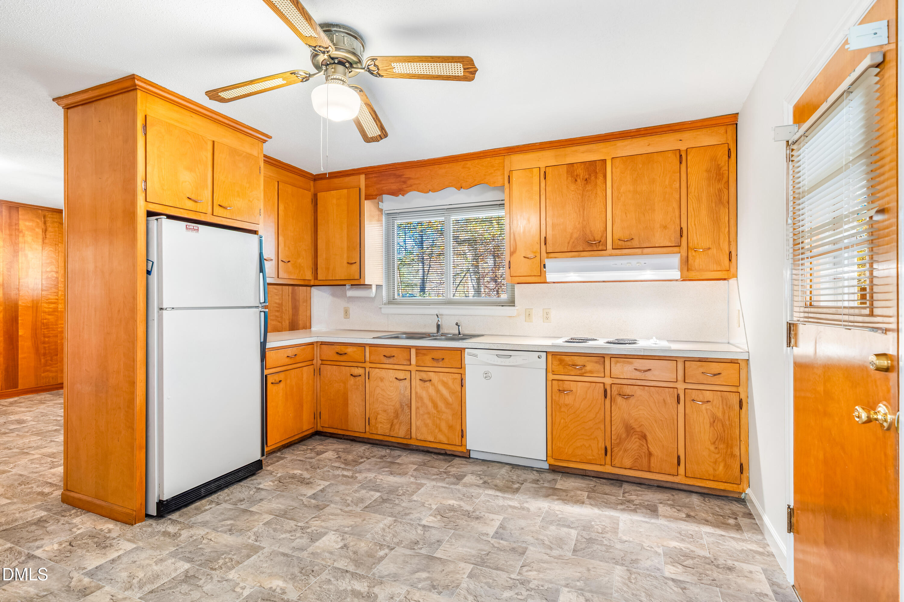 4714 West Hills Drive Durham, NC 27705 - Photo 6 of 27 a kitchen with stainless steel appliances granite countertop a refrigerator and a sink