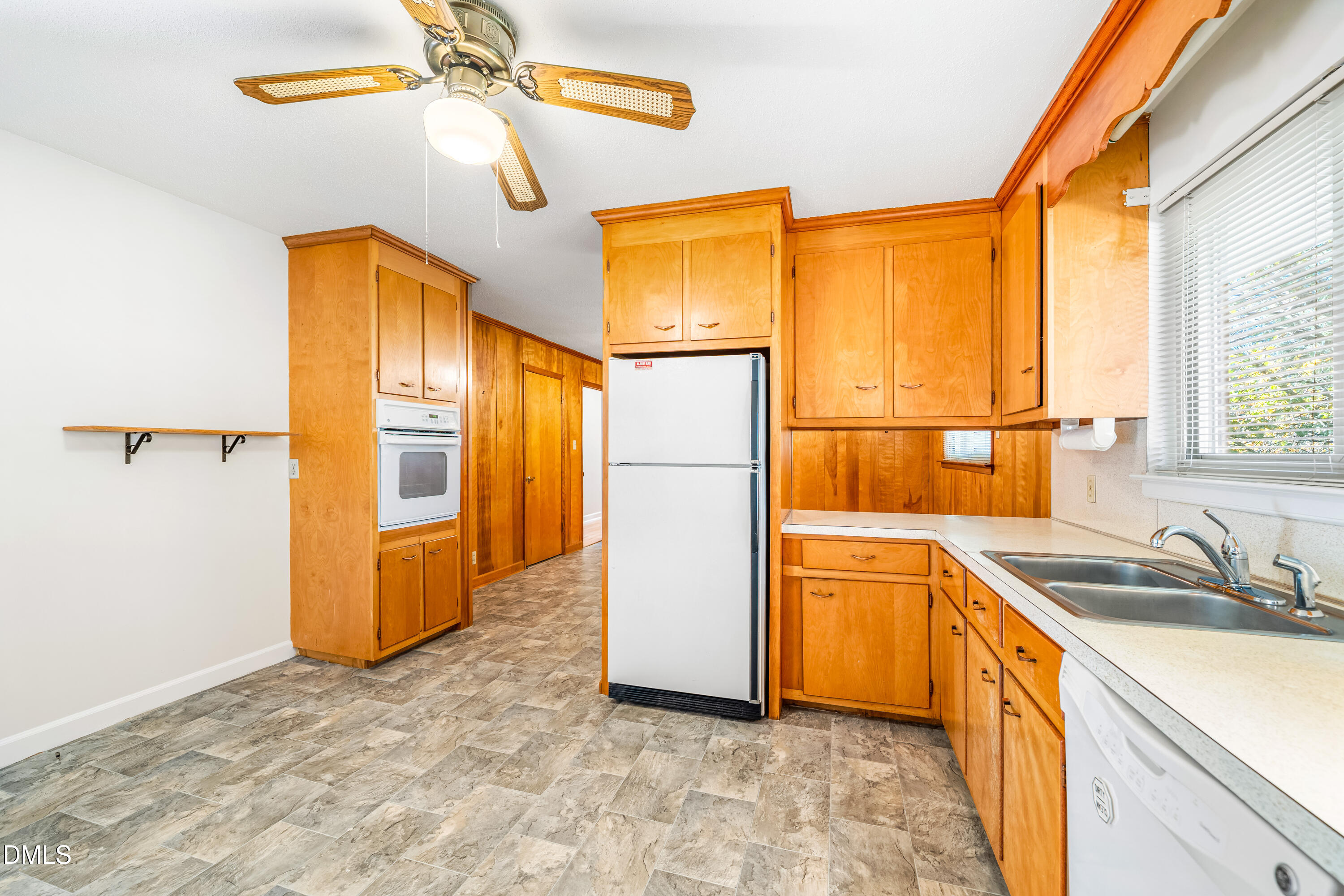 4714 West Hills Drive Durham, NC 27705 - Photo 7 of 27 a kitchen with a refrigerator a sink and dishwasher