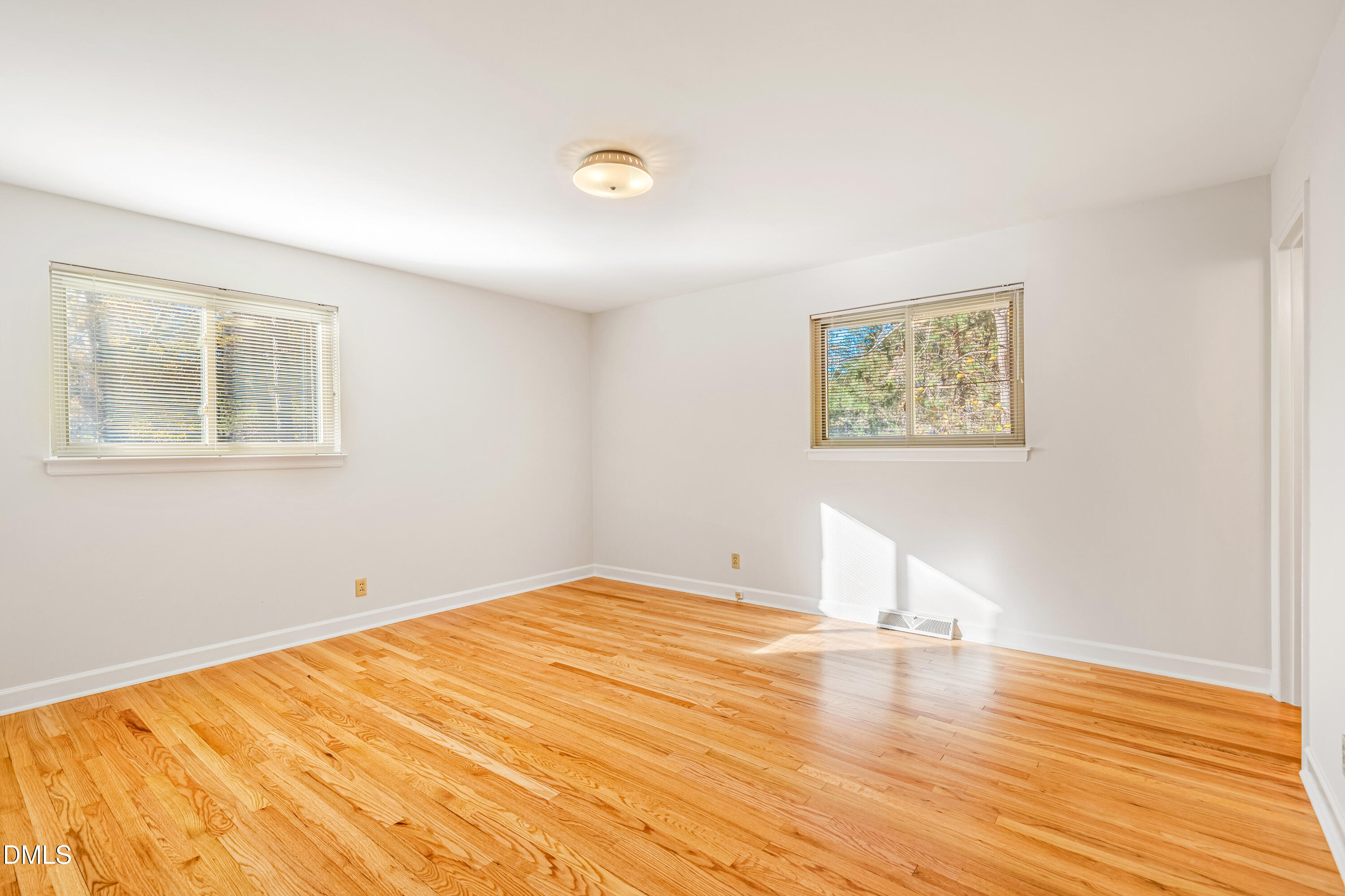 4714 West Hills Drive Durham, NC 27705 - Photo 10 of 27 a view of empty room with wooden floor