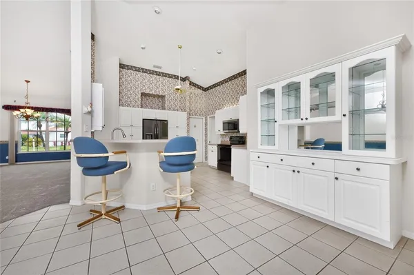 a kitchen with stainless steel appliances a stove sink microwave and cabinets