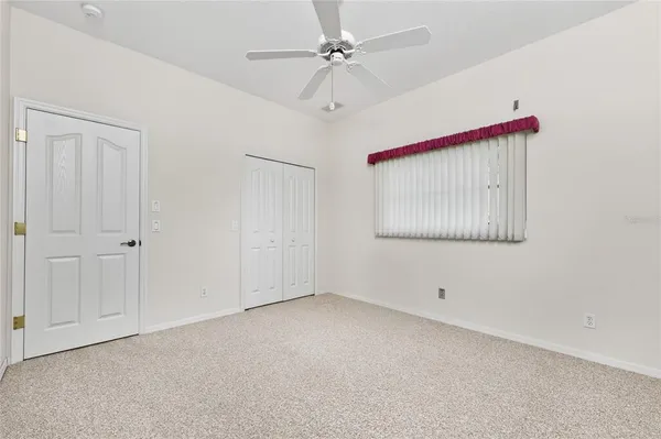 a view of a livingroom with table & cabinets
