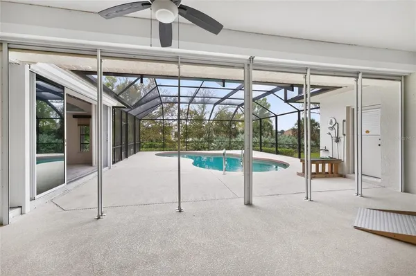 a view of a swimming pool with a backyard