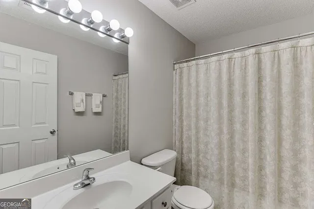 a close up view of a storage and utility room with washer and dryer