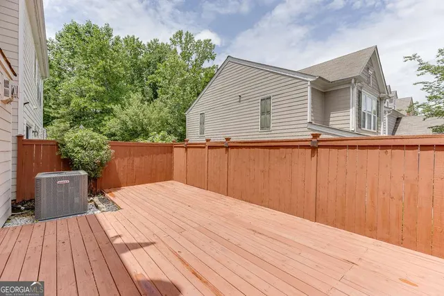 a backyard of a house with wooden floor