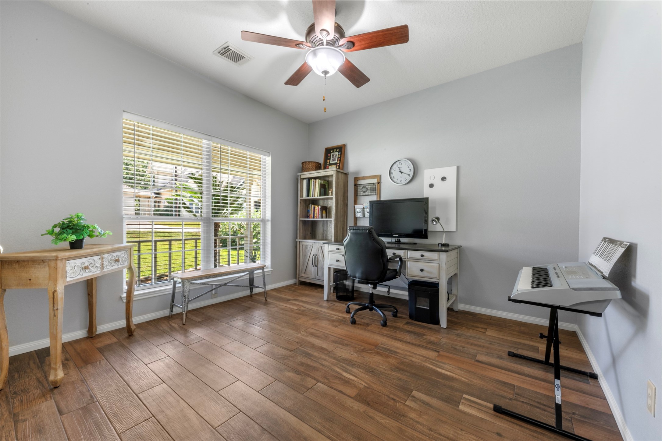 381 West Lake Drive Point Blank, TX 77364 - Photo 19 of 33 This secondary room is currently used as an office with wood-look floors and large windows. This room is ideal for working from home, studying, or pursuing hobbies in a comfortable setting.