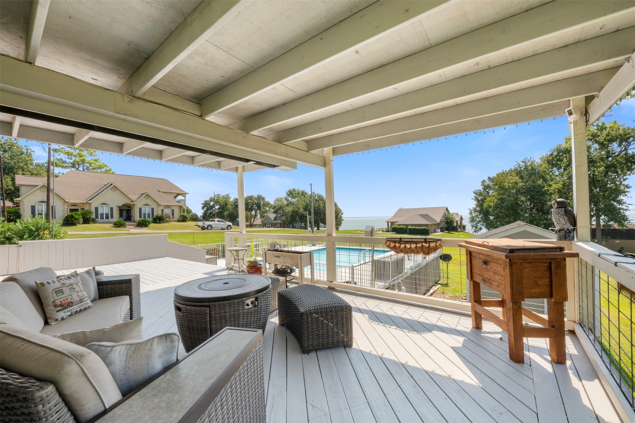 381 West Lake Drive Point Blank, TX 77364 - Photo 24 of 33 The covered patio area offers shade and comfort while still enjoying poolside views. Ideal for entertaining year-round with room for seating and dining.
