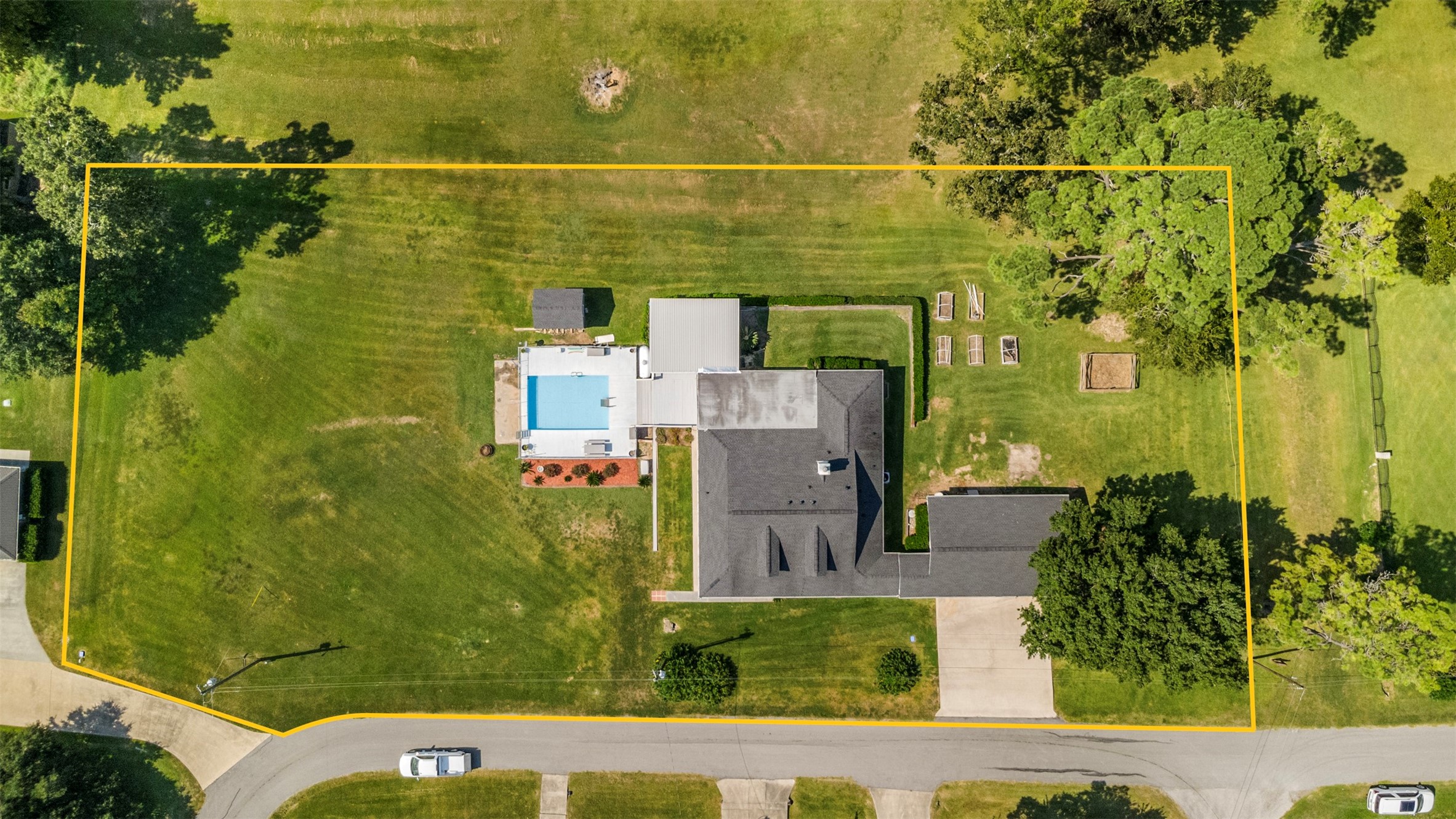 381 West Lake Drive Point Blank, TX 77364 - Photo 31 of 33 This aerial outlines the full property, revealing over an acre of space with a pool, workshop, and expansive yard — all just steps from the lake.
*property lines are approx*