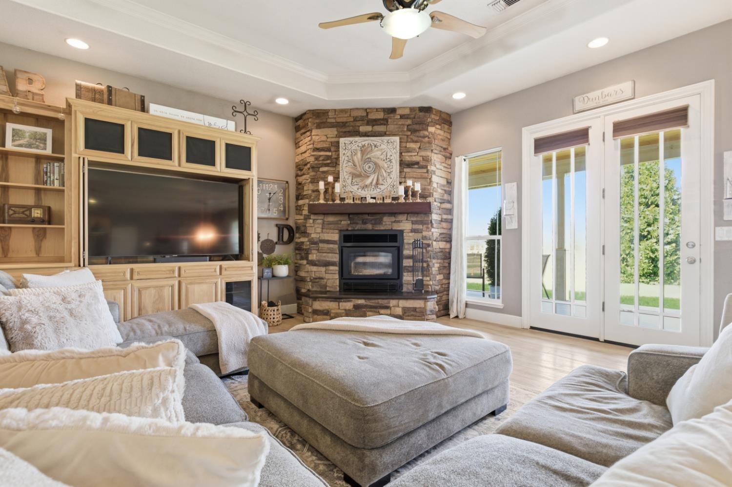 3302 Bear River Drive Rio Oso, CA 95674 - Photo 12 of 93 a living room with furniture a flat screen tv and a fireplace