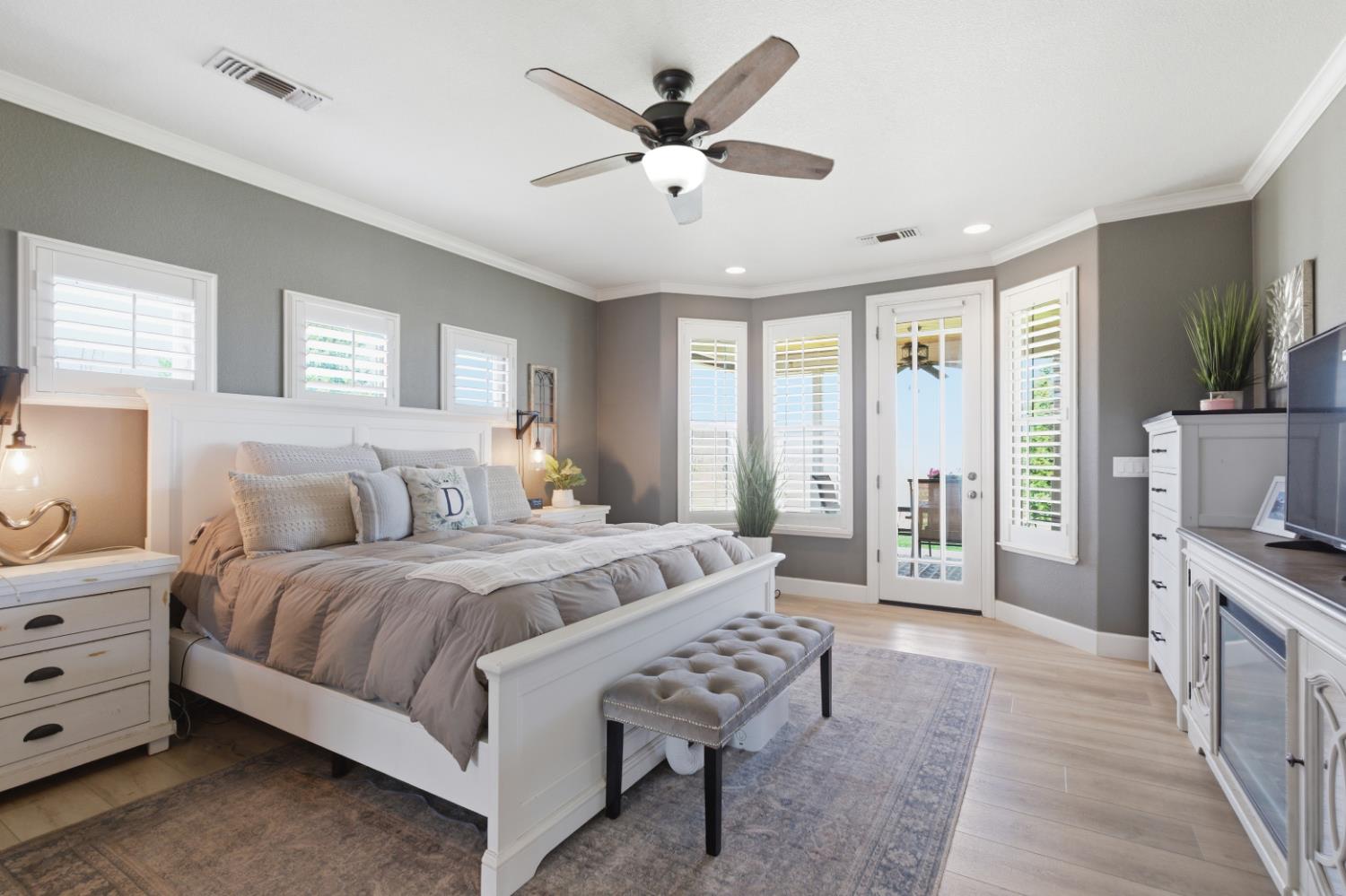3302 Bear River Drive Rio Oso, CA 95674 - Photo 32 of 93 a spacious bedroom with a bed a couch and a flat tv screen