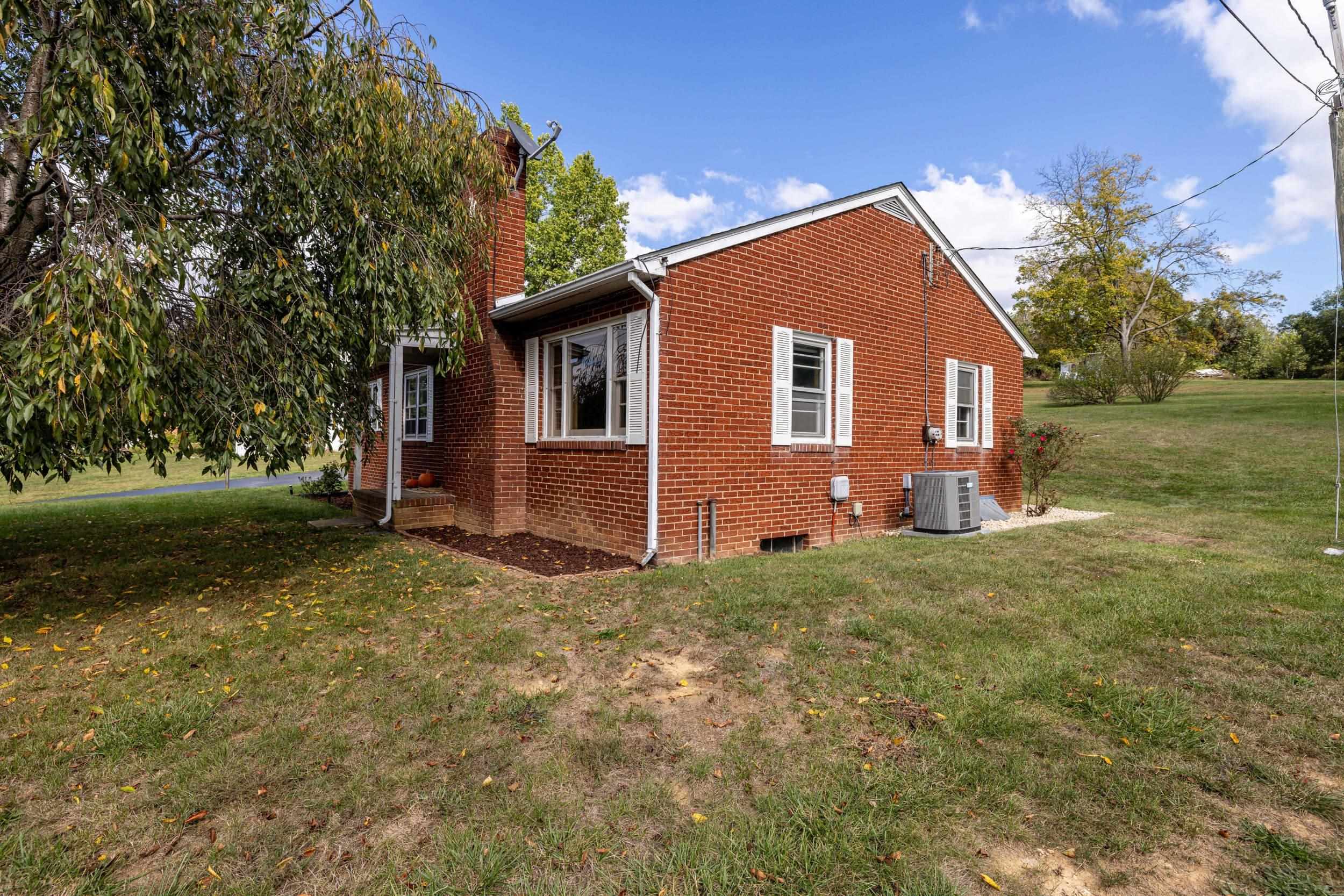 161 Boyers Road Harrisonburg, VA 22801 - Photo 56 of 74 a backyard of a house with plants and large tree