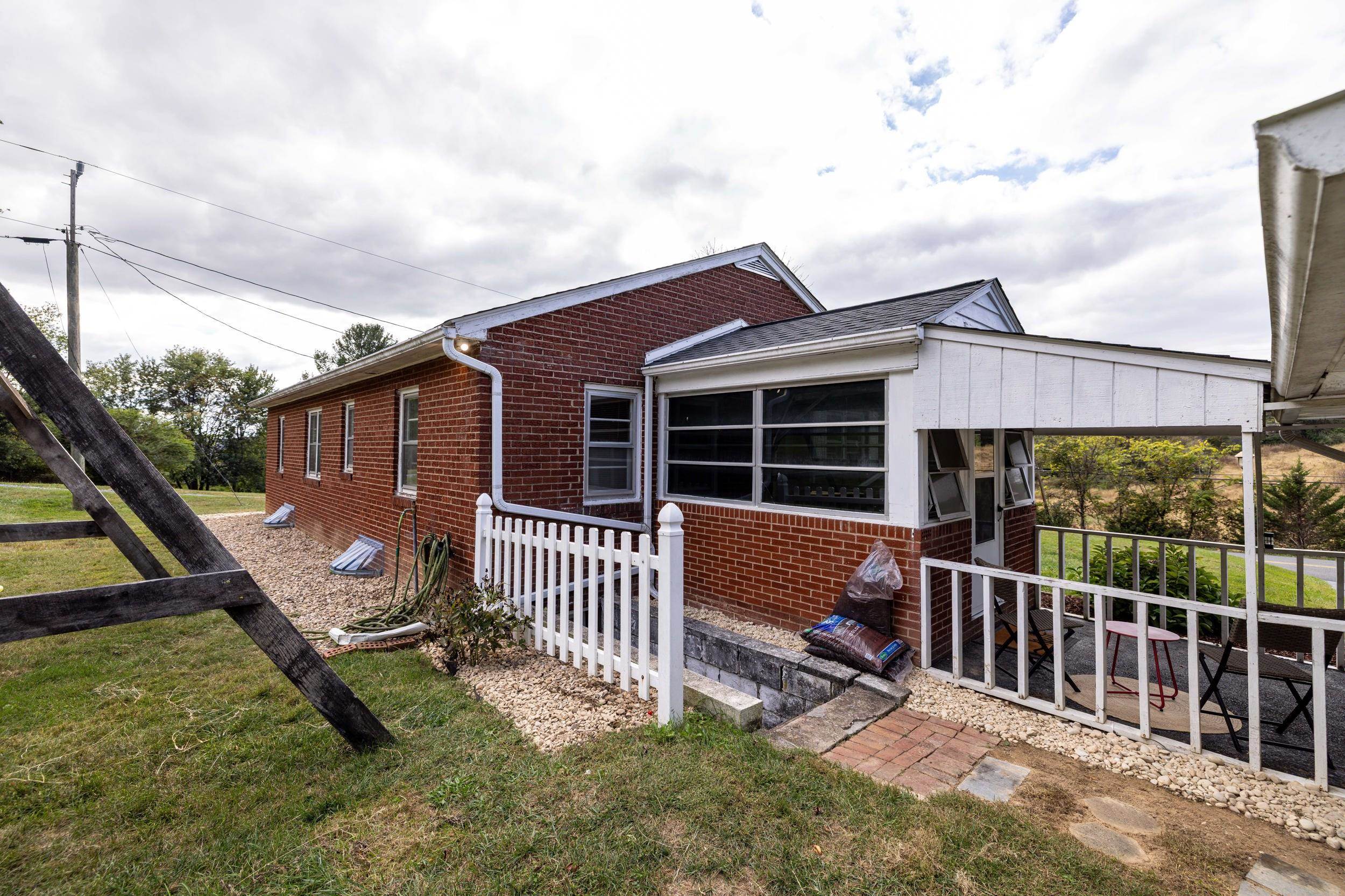 161 Boyers Road Harrisonburg, VA 22801 - Photo 60 of 74 a view of a house with a wooden deck and a yard
