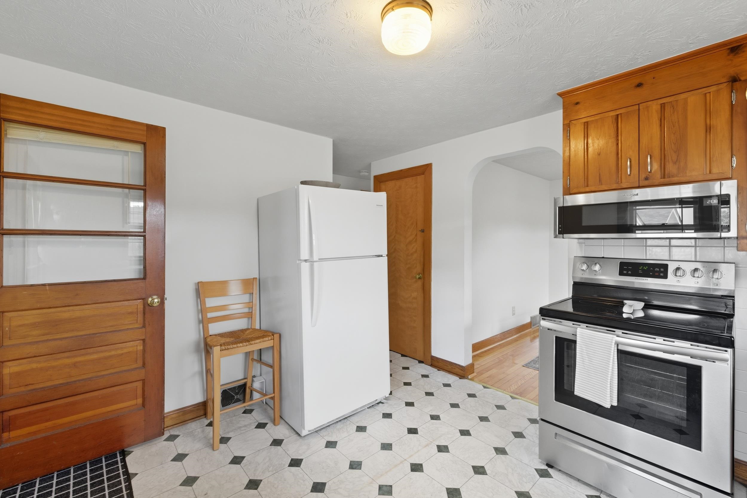 161 Boyers Road Harrisonburg, VA 22801 - Photo 7 of 74 a kitchen with a refrigerator and a stove top oven