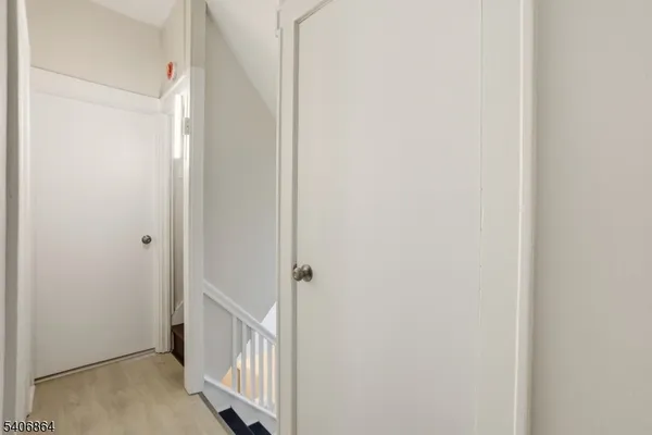 a bathroom with a toilet a sink and a mirror