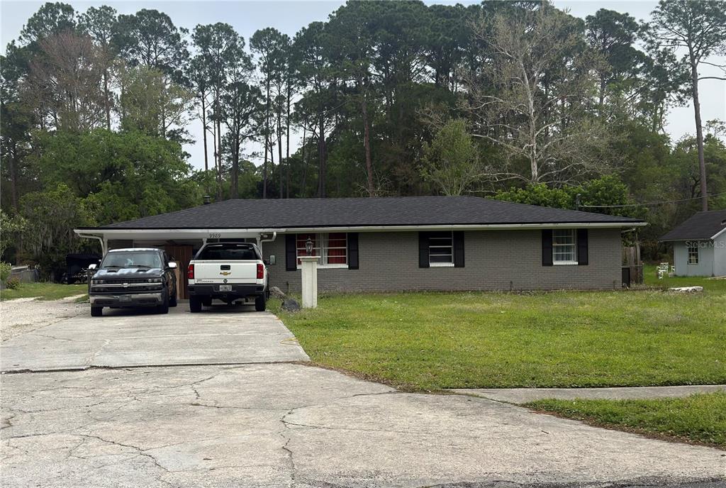 a view of a house with a back yard