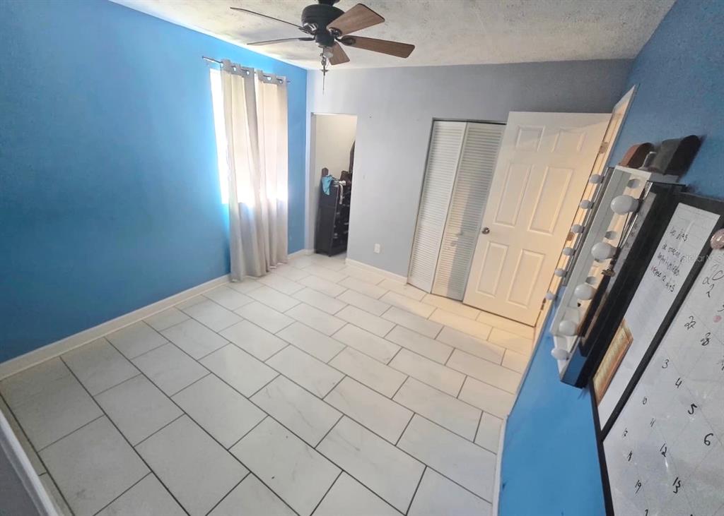 9989 Leahy Road Jacksonville, FL 32246 - Photo 13 of 21 a large white bed in a white room