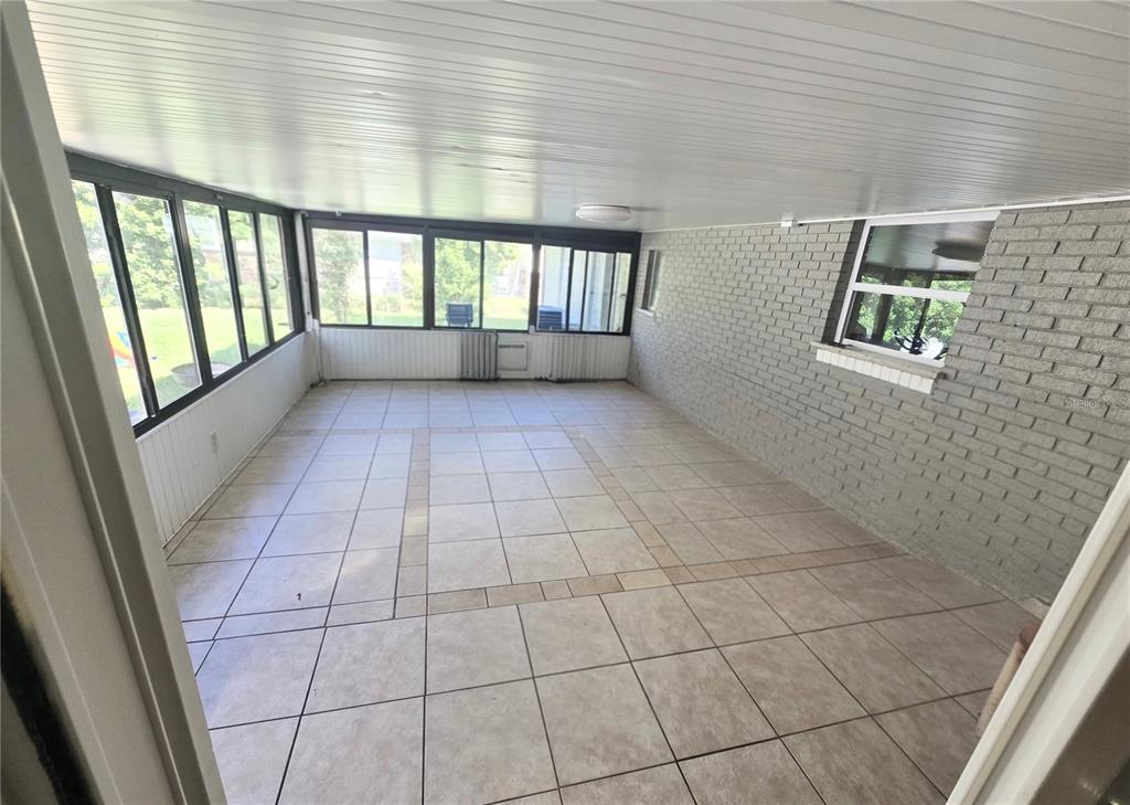 9989 Leahy Road Jacksonville, FL 32246 - Photo 15 of 21 a view of an empty room and a window