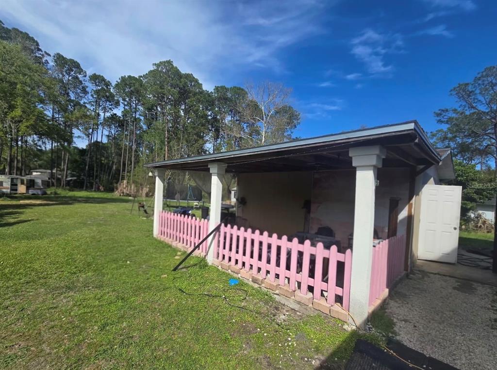 9989 Leahy Road Jacksonville, FL 32246 - Photo 20 of 21 a front view of a house with garden