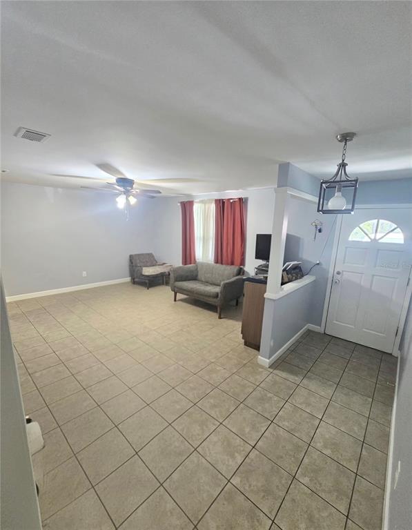 9989 Leahy Road Jacksonville, FL 32246 - Photo 5 of 21 a view of a room with gym equipment and a large window