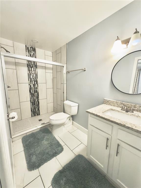 9989 Leahy Road Jacksonville, FL 32246 - Photo 9 of 21 a bathroom with a sink a toilet and shower