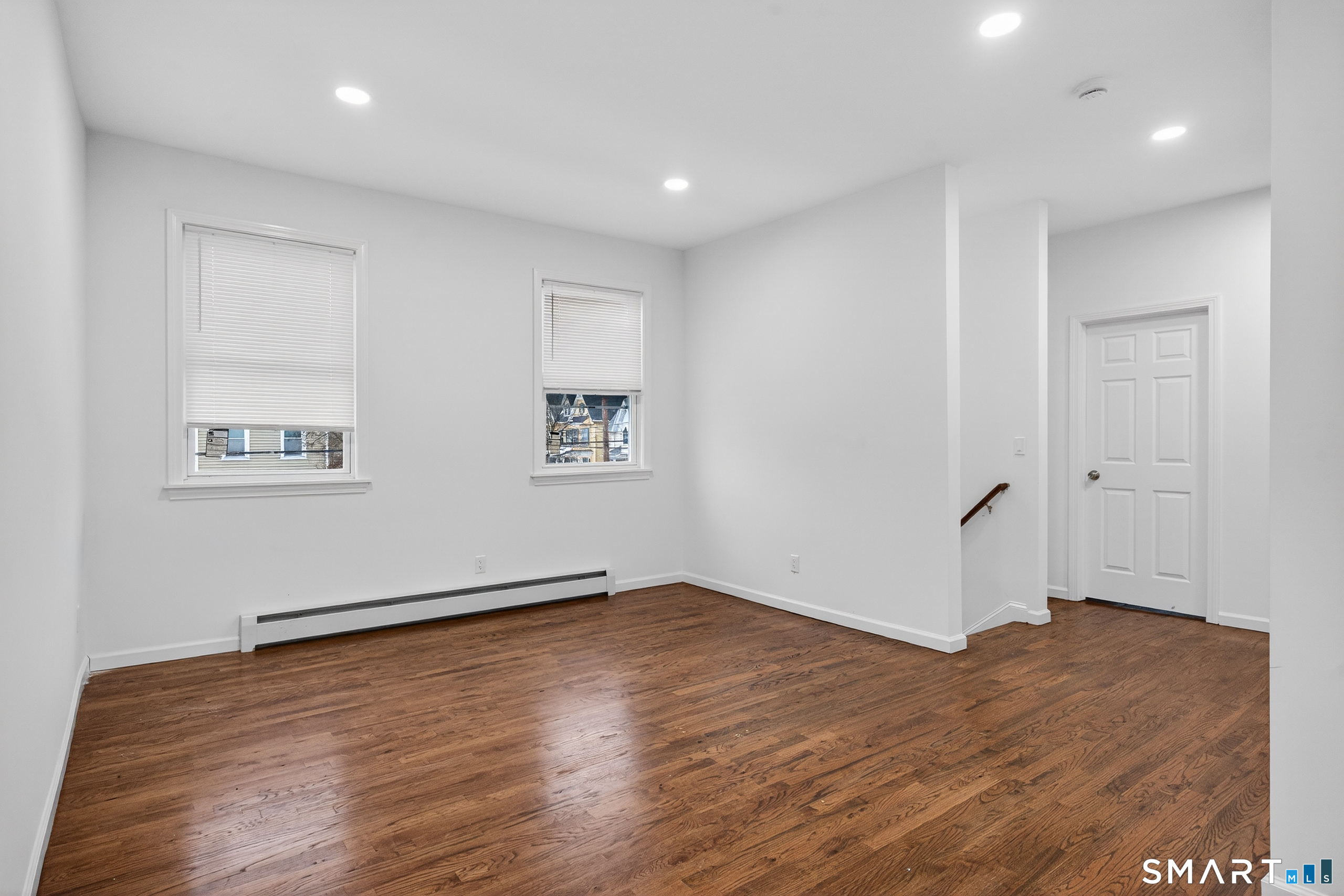 144 Cottage Street, Unit 2 Bridgeport, CT 06605 - Photo 2 of 12 a view of empty room with wooden floor