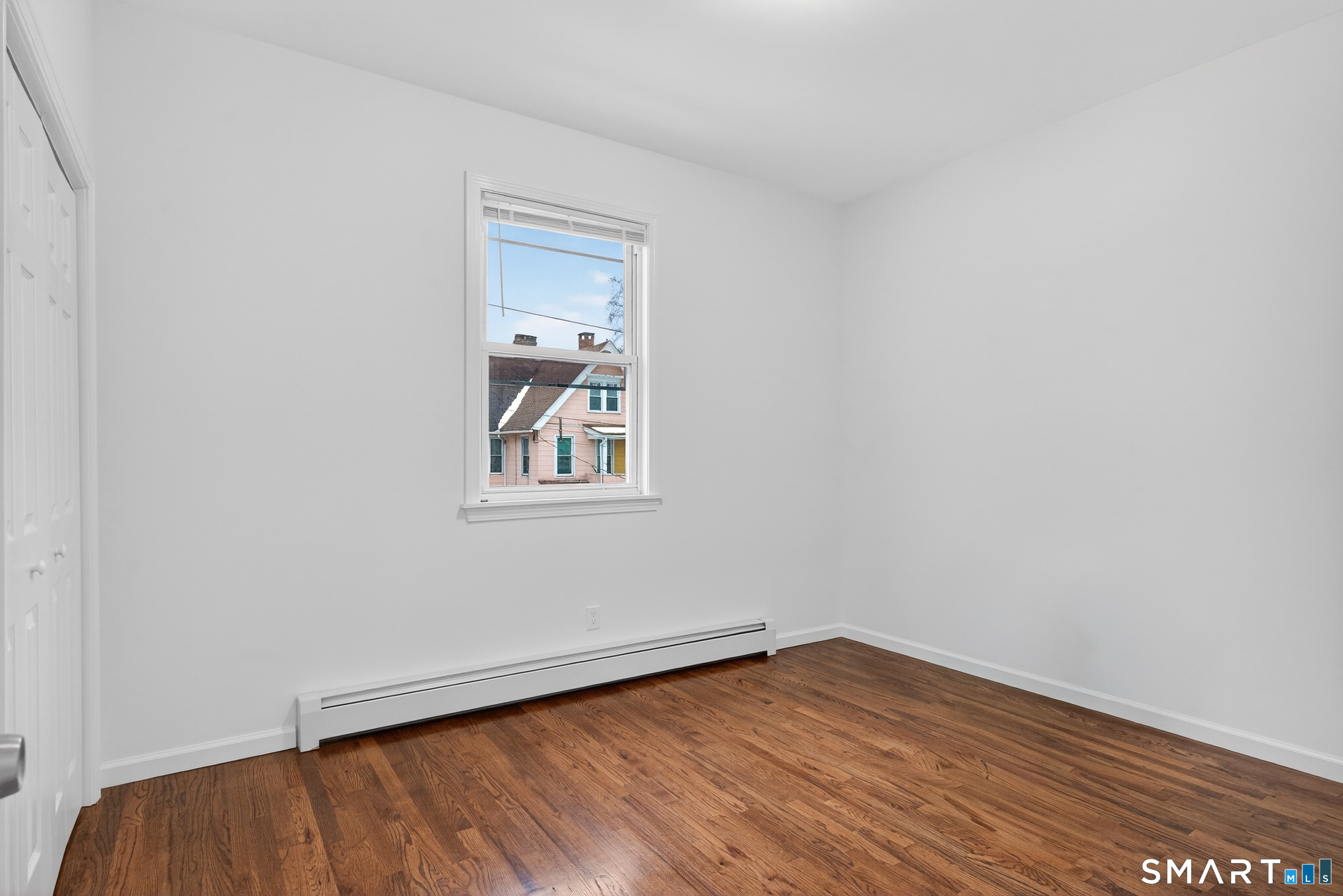 144 Cottage Street, Unit 2 Bridgeport, CT 06605 - Photo 6 of 12 wooden floor in an empty room