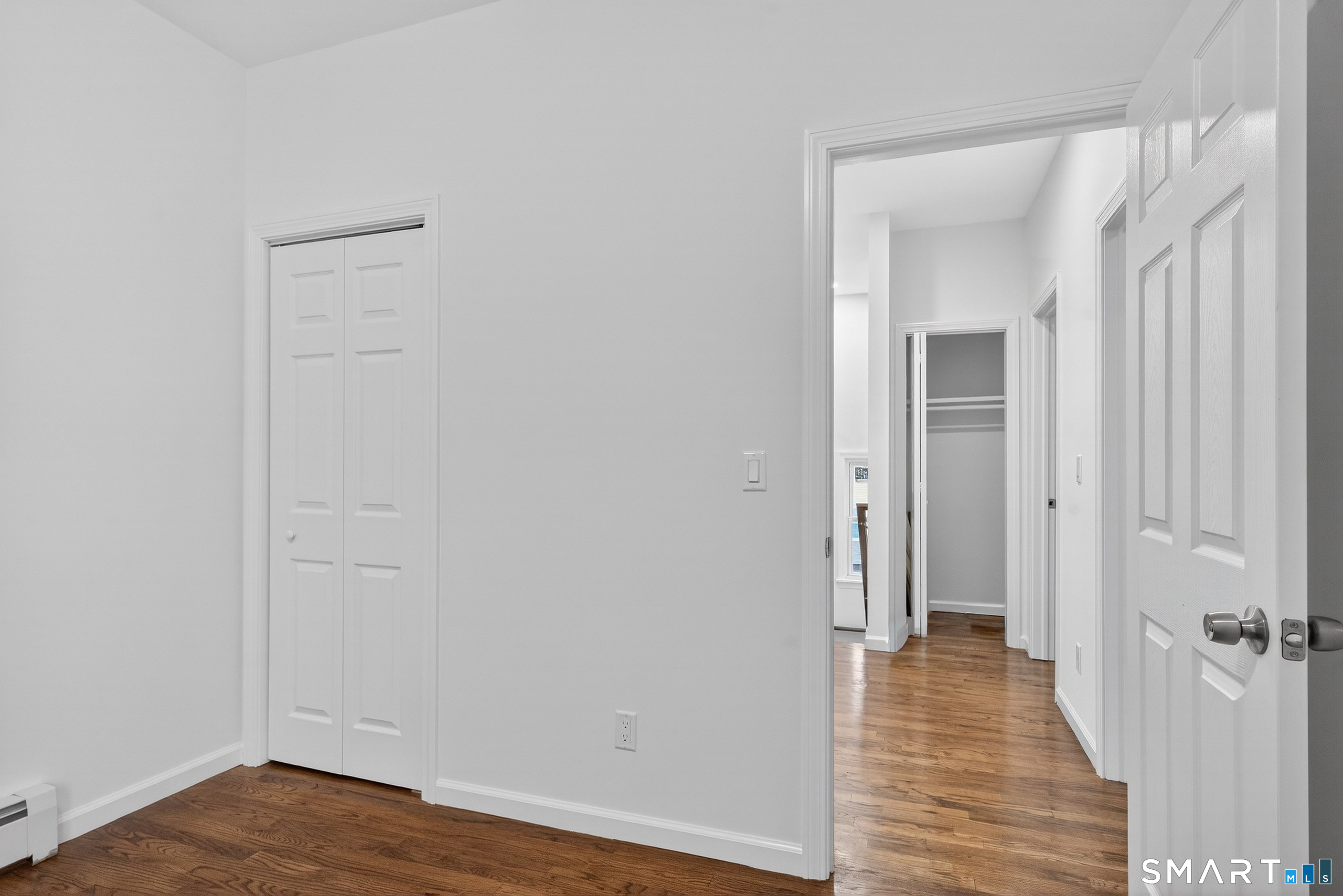 144 Cottage Street, Unit 2 Bridgeport, CT 06605 - Photo 7 of 12 a view of a hallway with wooden floor