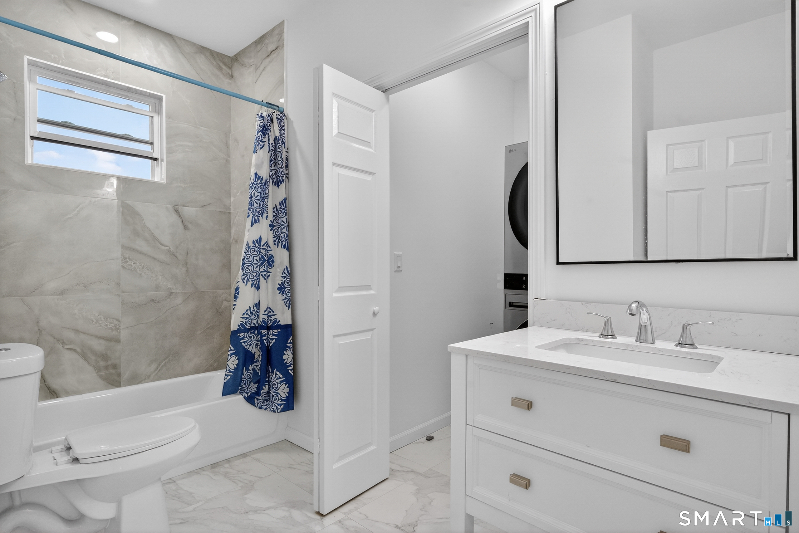 144 Cottage Street, Unit 2 Bridgeport, CT 06605 - Photo 9 of 12 a bathroom with a sink a toilet and shower