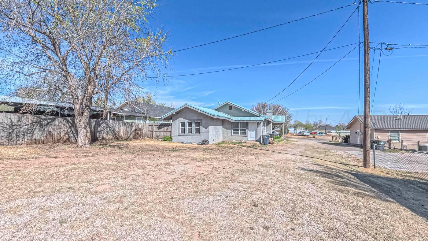 1316 Withers Avenue Amarillo, TX 79108 - Photo 5 of 19 a view of a house with a yard