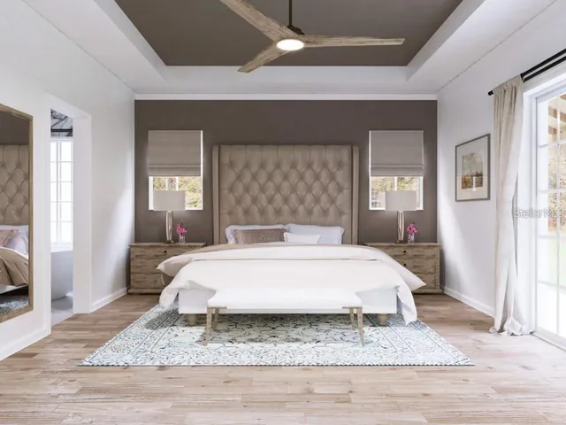 a spacious bedroom with a large bed and a table