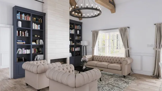 a living room with furniture a rug and a large window