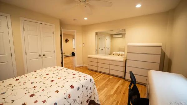 a bedroom with a bed and a cabinets