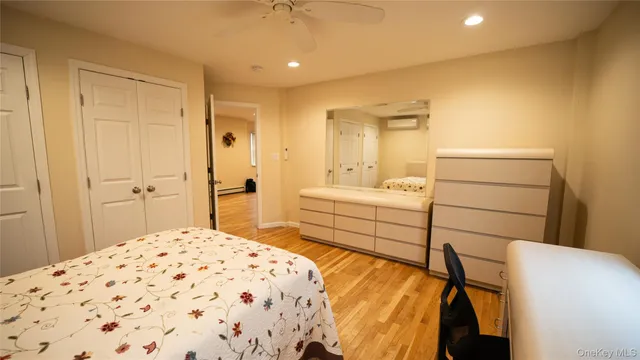 a bedroom with a bed and a cabinets