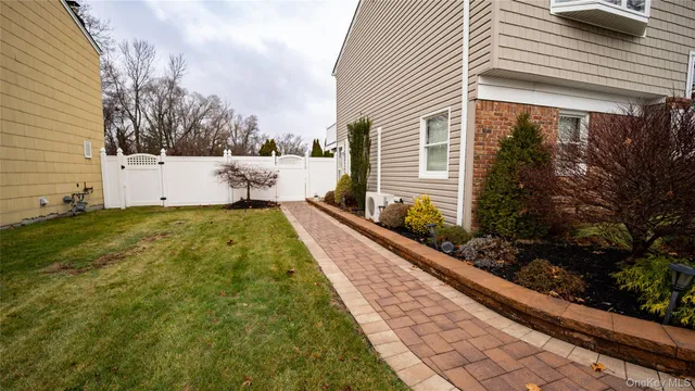 a view of a backyard with sitting area