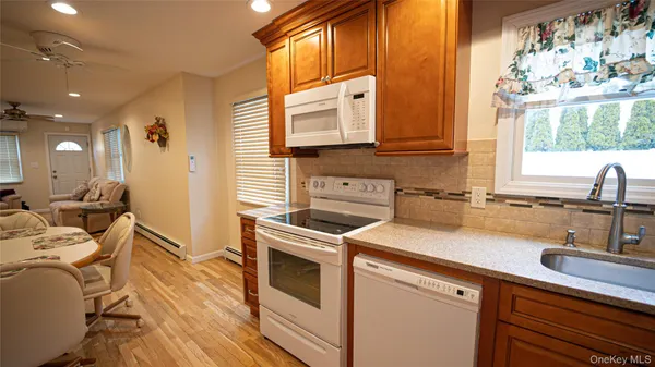 a kitchen that has a sink and a stove